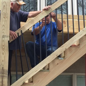 Dustin working with his father on new deck