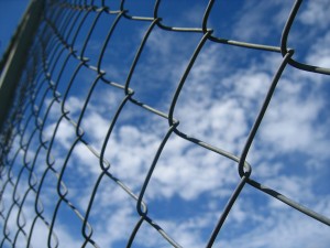 Chain link fence with blue sky